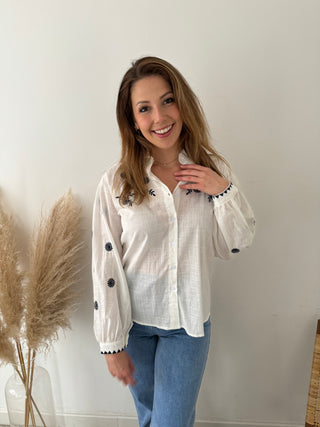 Blue embroidered flowers white blouse