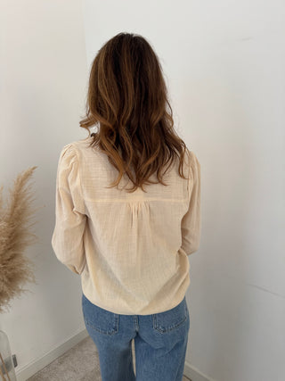 Burgundy details beige blouse