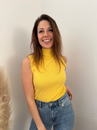 Yellow sleeveless turtleneck top