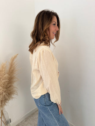 Burgundy details beige blouse