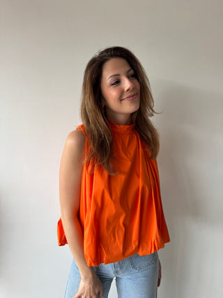 Open back bow orange top