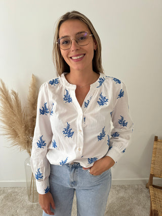 Blue leaves white blouse