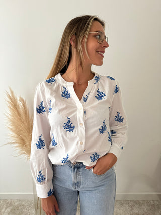 Blue leaves white blouse