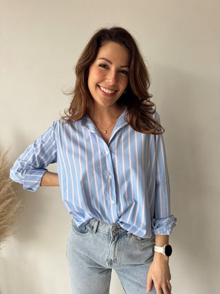 Pink details blue blouse