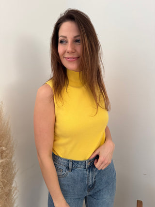 Yellow sleeveless turtleneck top