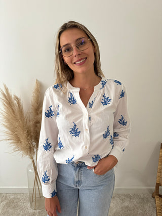 Blue leaves white blouse