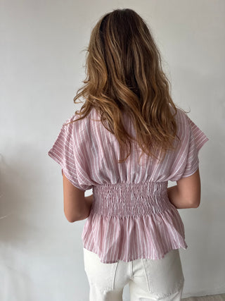 Pink peplum top