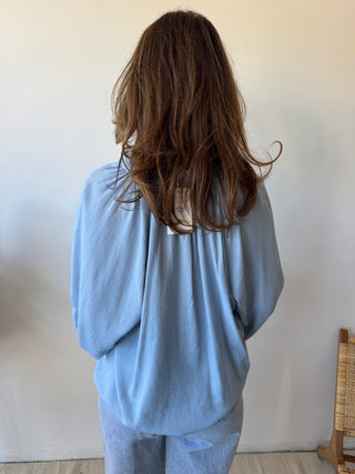 Pink detail blue blouse