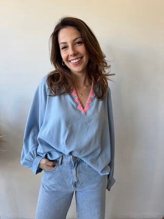 Pink detail blue blouse