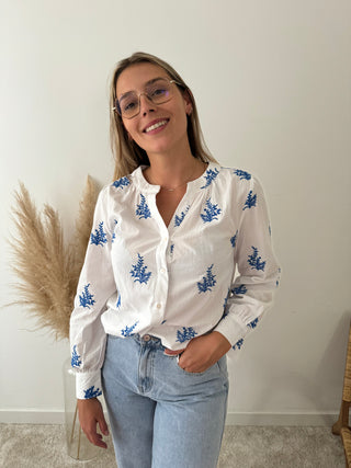 Blue leaves white blouse