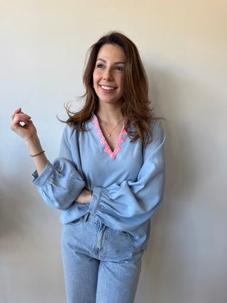 Pink detail blue blouse
