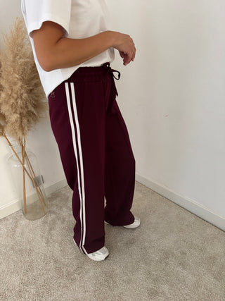 White stripe burgundy pants