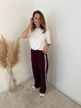 White stripe burgundy pants