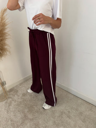 White stripe burgundy pants
