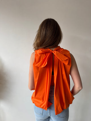 Open back bow orange top