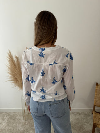 Blue leaves white blouse