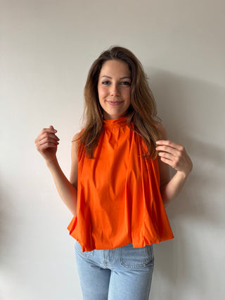 Open back bow orange top