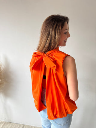 Open back bow orange top