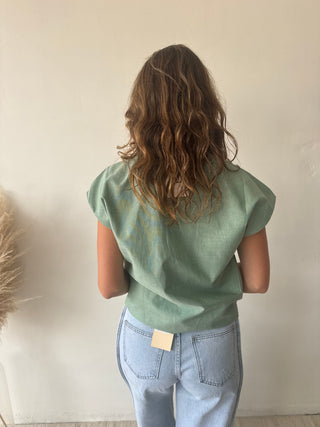 Green sleeveless shirt