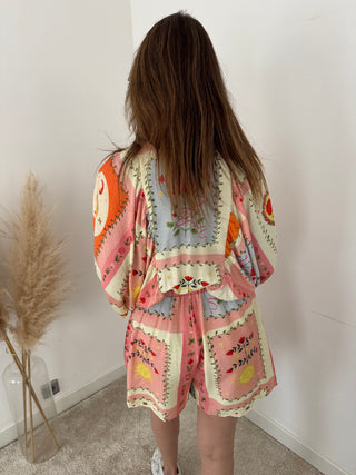 Orange pink flowered playsuit