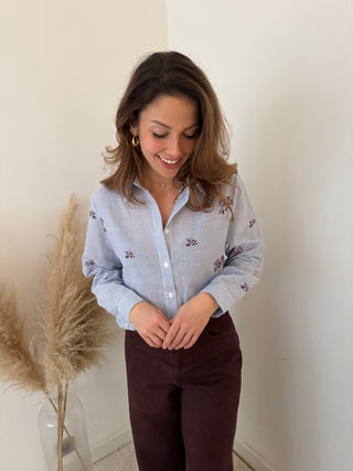 Burgundy flowers blue shirt