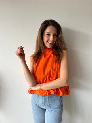 Open back bow orange top