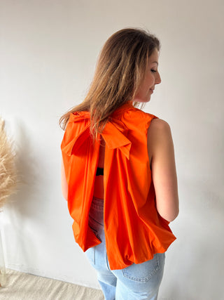 Open back bow orange top