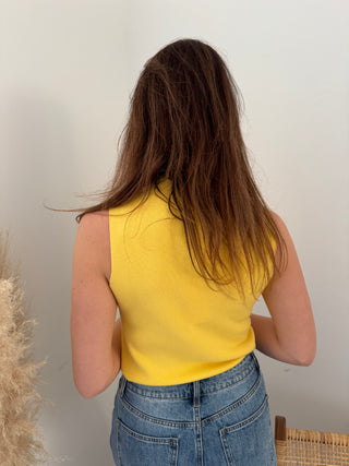 Yellow sleeveless turtleneck top