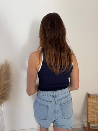 White details navy ribbed top