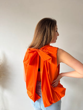 Open back bow orange top