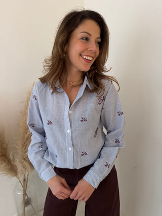 Burgundy flowers blue shirt