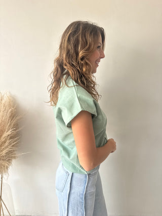 Green sleeveless shirt