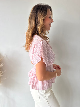 Pink peplum top