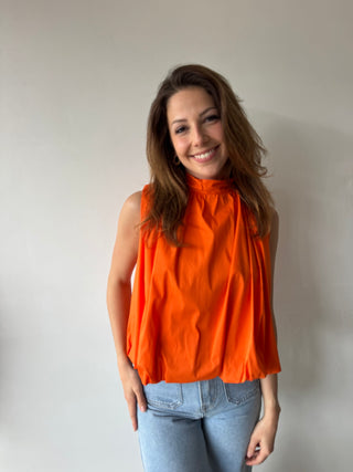 Open back bow orange top