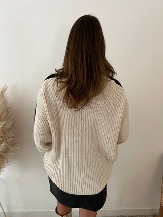 Black sleeves white knit
