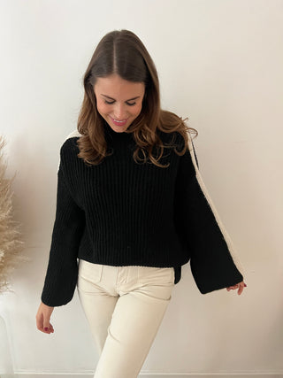 White sleeve black knit